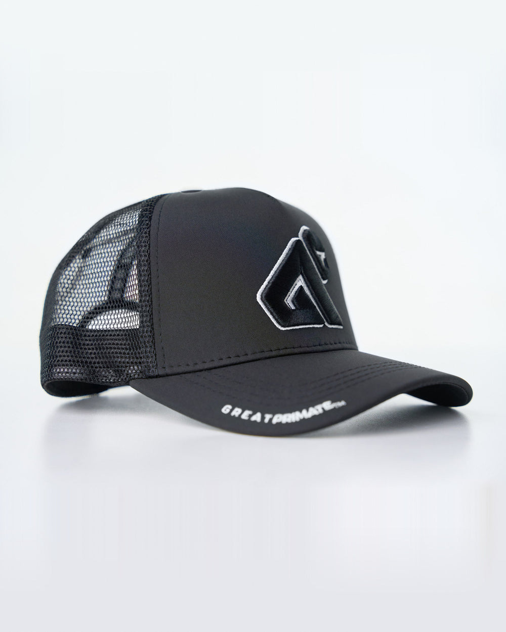 Black Primis Trucker Hat, three-quarter studio-product