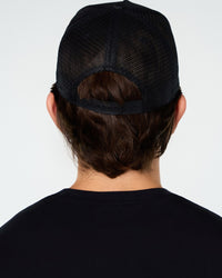 Black Primis Trucker Hat, back on-model
