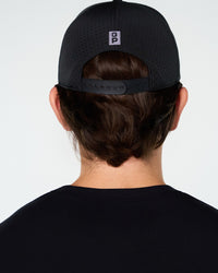 Black Primis Flat Brim Cap, back on-model